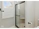 Bathroom features a glass shower with built-in seat and matching shutters at 8939 Spider Bay Ct, Indianapolis, IN 46236