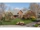 Charming two-story brick home with a well-manicured lawn and landscaping, showcasing its curb appeal at 8939 Spider Bay Ct, Indianapolis, IN 46236