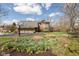 Charming two-story home with a three-car garage, basketball hoop, and a beautiful flower garden at 8939 Spider Bay Ct, Indianapolis, IN 46236