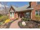 Inviting front entrance with a brick walkway, manicured landscaping, and a charming porch area at 8939 Spider Bay Ct, Indianapolis, IN 46236