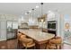 Gourmet kitchen with a center island, stainless steel appliances, and custom cabinets at 8939 Spider Bay Ct, Indianapolis, IN 46236