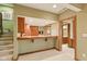 The kitchenette includes warm wood accents, tile flooring, and open access to the main floor at 8939 Spider Bay Ct, Indianapolis, IN 46236