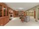 Open concept living room showcases a brick fireplace, recessed lighting and custom wood built-ins at 8939 Spider Bay Ct, Indianapolis, IN 46236
