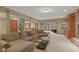 Cozy living room boasts natural light, neutral carpet, and an open layout with backyard access at 8939 Spider Bay Ct, Indianapolis, IN 46236