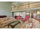 Spacious living room with high ceilings, large windows, and a view of the upper-level balcony at 8939 Spider Bay Ct, Indianapolis, IN 46236