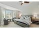 Spacious main bedroom featuring large windows, sitting area, and plush carpeting at 8939 Spider Bay Ct, Indianapolis, IN 46236