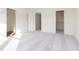 Spacious bedroom featuring plush carpeting and doorways to an ensuite and walk-in closet at 9738 Behner Dr, Fishers, IN 46250