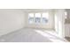 Bright bedroom with large windows offering a lovely neighborhood view and neutral carpeting at 9738 Behner Dr, Fishers, IN 46250