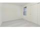 Cozy bedroom featuring plush carpeting, a window, and a closet with sliding doors at 9738 Behner Dr, Fishers, IN 46250