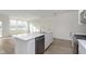 Open concept kitchen with stainless steel appliances and hardwood floors at 9738 Behner Dr, Fishers, IN 46250