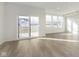 Sun-filled living room featuring a sliding glass door and hardwood floors at 9738 Behner Dr, Fishers, IN 46250
