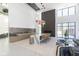 Spacious lounge area features modern decor, a fireplace, a kitchen and lots of natural light at 9738 Behner Dr, Fishers, IN 46250