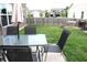 Inviting backyard patio with a table, chairs, and umbrella, perfect for outdoor entertaining with its privacy fence at 981 Redwood Dr, Franklin, IN 46131