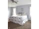 Spacious bedroom featuring tray ceilings, neutral walls, carpet, and bright windows at 981 Redwood Dr, Franklin, IN 46131