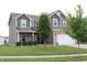 Inviting two-story home with a manicured lawn and a two-car garage at 981 Redwood Dr, Franklin, IN 46131