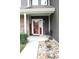 Charming front porch with landscaping, a welcome sign, and seating at 981 Redwood Dr, Franklin, IN 46131