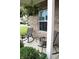 Relaxing covered front porch with rocking chairs and green landscaping at 981 Redwood Dr, Franklin, IN 46131