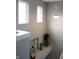 Bright hallway with natural light, decorative accents, and neutral paint, creating a welcoming transition between spaces at 981 Redwood Dr, Franklin, IN 46131