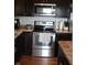 Kitchen featuring stainless steel stove and oven with dark cabinets and countertops at 981 Redwood Dr, Franklin, IN 46131