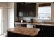The kitchen has dark cabinets and stainless steel appliances with a sliding glass door at 981 Redwood Dr, Franklin, IN 46131