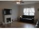 Modern living room with a cozy fireplace and comfortable seating at 981 Redwood Dr, Franklin, IN 46131