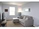Cozy living room featuring a comfortable sectional sofa, neutral decor, and ample natural light for a relaxing space at 981 Redwood Dr, Franklin, IN 46131