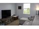 Comfortable living room with a couch, TV, and window, creating an inviting space for entertainment and relaxation at 981 Redwood Dr, Franklin, IN 46131