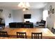 Open concept living area featuring a dining table and a fireplace at 981 Redwood Dr, Franklin, IN 46131