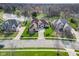 Aerial view of a beautiful brick home with a long driveway and lush lawn at 9877 Wading Crane Ave, Fishers, IN 46055