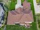 Stunning aerial view of the expansive home with well-maintained roof and landscape at 9877 Wading Crane Ave, Fishers, IN 46055