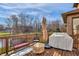 Outdoor deck featuring comfortable seating, a grill, and views of the backyard and trees at 9877 Wading Crane Ave, Fishers, IN 46055