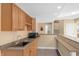 Wet bar in the finished basement featuring ample storage, granite counters, and a microwave at 9877 Wading Crane Ave, Fishers, IN 46055