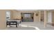 Finished basement features a media area, games, and neutral carpeting throughout at 9877 Wading Crane Ave, Fishers, IN 46055