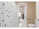 Bathroom featuring tile flooring and a modern toilet at 9877 Wading Crane Ave, Fishers, IN 46055