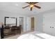 Bedroom view with ensuite access, ceiling fan, double door closet, and lots of light at 9877 Wading Crane Ave, Fishers, IN 46055
