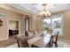Dining room with decorative ceiling and ample natural light from large windows at 9877 Wading Crane Ave, Fishers, IN 46055