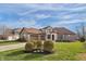 Beautiful two-story home with lush lawn and landscaping at 9877 Wading Crane Ave, Fishers, IN 46055