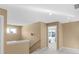 Upstairs hallway with carpeted floor, stairway, and bedroom entrance at 9877 Wading Crane Ave, Fishers, IN 46055