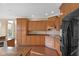 Updated kitchen with granite countertops, custom cabinets, stainless steel appliances, and hardwood floors at 9877 Wading Crane Ave, Fishers, IN 46055