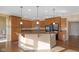 Open-concept kitchen with center island, granite countertops, and stainless steel appliances at 9877 Wading Crane Ave, Fishers, IN 46055