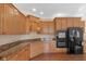 Updated kitchen with stainless appliances, custom cabinets, and granite countertops at 9877 Wading Crane Ave, Fishers, IN 46055