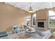 Bright living room with fireplace and vaulted ceilings and lots of natural light at 9877 Wading Crane Ave, Fishers, IN 46055