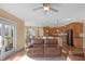 Open-concept living room with hardwood floors and access to kitchen and dining areas at 9877 Wading Crane Ave, Fishers, IN 46055
