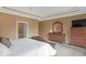 Relaxing main bedroom features traditional-style furniture, a mirror, and a walk-in closet at 9877 Wading Crane Ave, Fishers, IN 46055