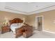 Comfortable main bedroom offering soft carpet, wood furniture, and neutral color scheme at 9877 Wading Crane Ave, Fishers, IN 46055