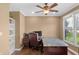 Office space featuring a large desk, a ceiling fan and a window view of the outdoors at 9877 Wading Crane Ave, Fishers, IN 46055