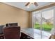 Office space featuring a large desk, a ceiling fan and a window view of the outdoors at 9877 Wading Crane Ave, Fishers, IN 46055