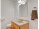 Compact bathroom with vanity, toilet, and towel rack in neutral tones at 102 E Thompson St, Lebanon, IN 46052