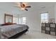 This bedroom has neutral carpet, and two windows for ample sunlight at 102 E Thompson St, Lebanon, IN 46052