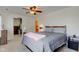 This bedroom has neutral carpet, a ceiling fan, walk-in closet, and en-suite bathroom at 102 E Thompson St, Lebanon, IN 46052